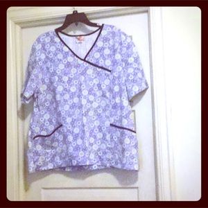 Blue and white floral print white cross scrub top